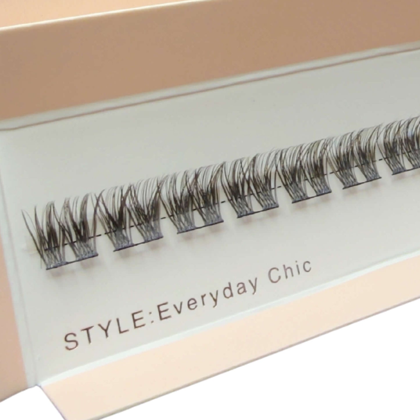 Box of false eyelashes with visible branding on a white background