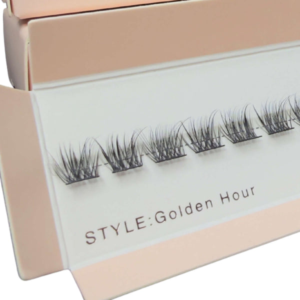 Eyelash extensions in a 'Golden Hour' style box with 'DreamLashUK' branding.
