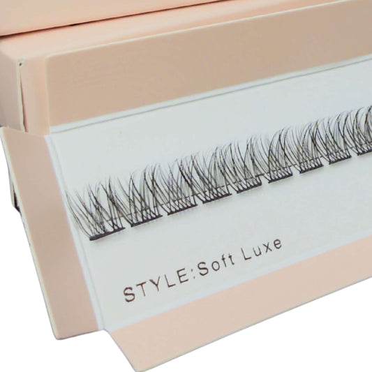 Eyelash extensions in a pink box with 'www.dreamlashuk.co.uk' branding.
