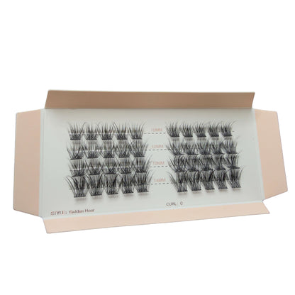 Box of false eyelashes with multiple pairs on a white background