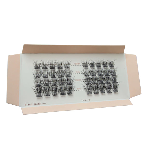 Box of false eyelashes with multiple pairs on a white background
