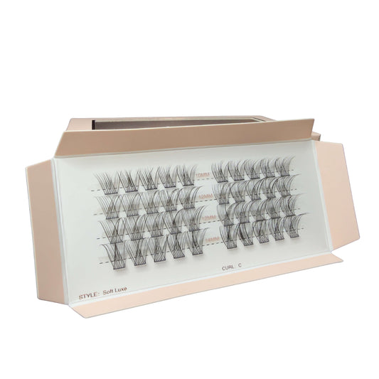 Eyelash extension set with a clear display case on a white background